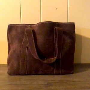Banana Republic brown suede tote with several pockets inside.